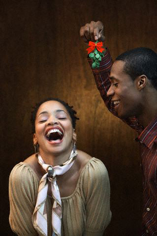 Young Laughing Couple with Mistletoe